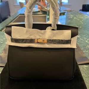 Chic Black Satchel with Gold Accents 100% leather